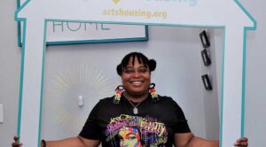 Photo of a resident in the Metcalfe Park neighborhood as she celebrates homeownership on July 31, 2023, at Acts Housing in Milwaukee. The new homebuyer fought back tears as she thanked Gorman & Company for providing her $100,000 of home equity for her and her family.