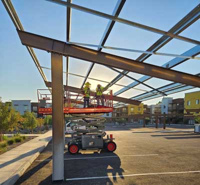 Construction of solar-ready canopy at Centerline on Glendale, an award-winning sustainable housing community by Gorman & Company in Glendale, AZ, featuring solar infrastructure installation over the residential parking area.