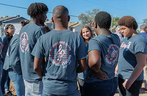 Students at Gorman & Company USA event wearing matching shirts for high school choir.